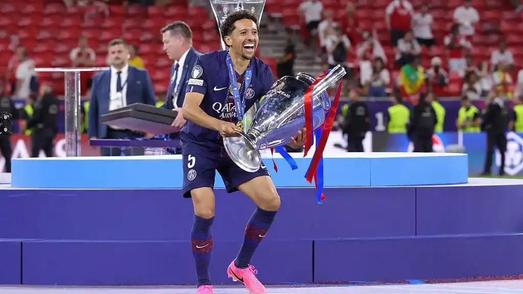 Marquinhos of Paris Saint-Germain celebrates with the 2025-26 Champions League trophy