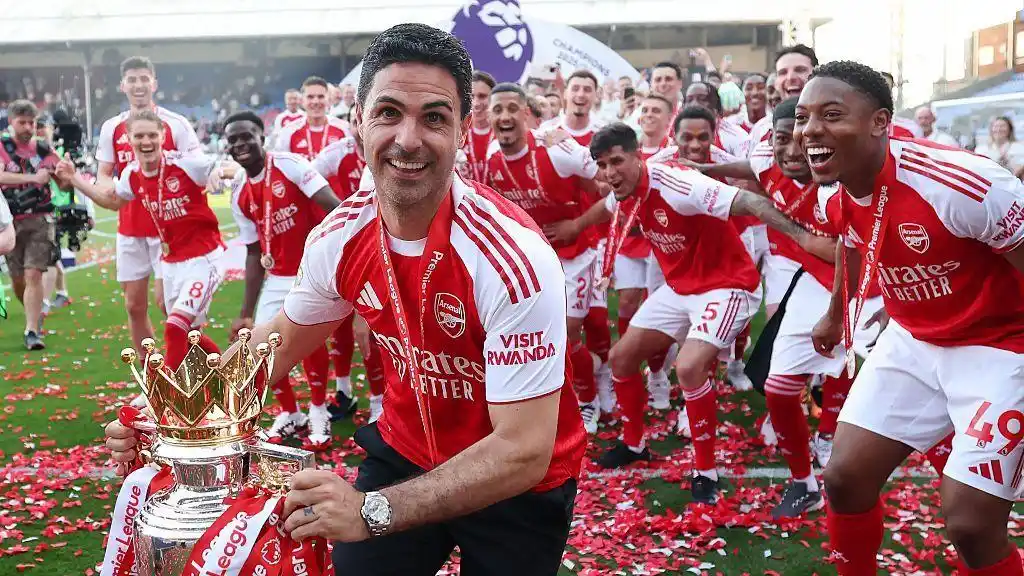 Arsenal manager Mikel Arteta celebrates with the Premier League trophy after the match again Crystal Palace at Selhurst Park on May 24, 2026
