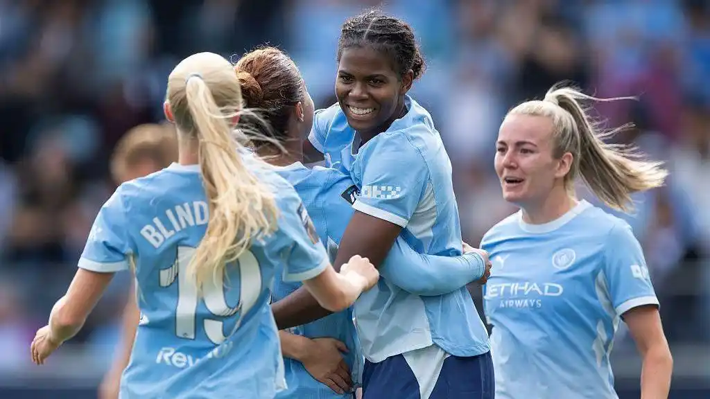 Manchester City players celebrate victory over Birmingham City