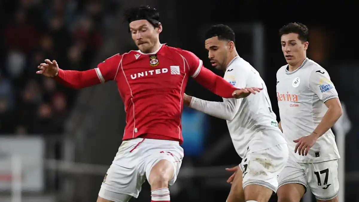 Kieffer Moore holds off Ben Cabango at the Swansea.com Stadium last season