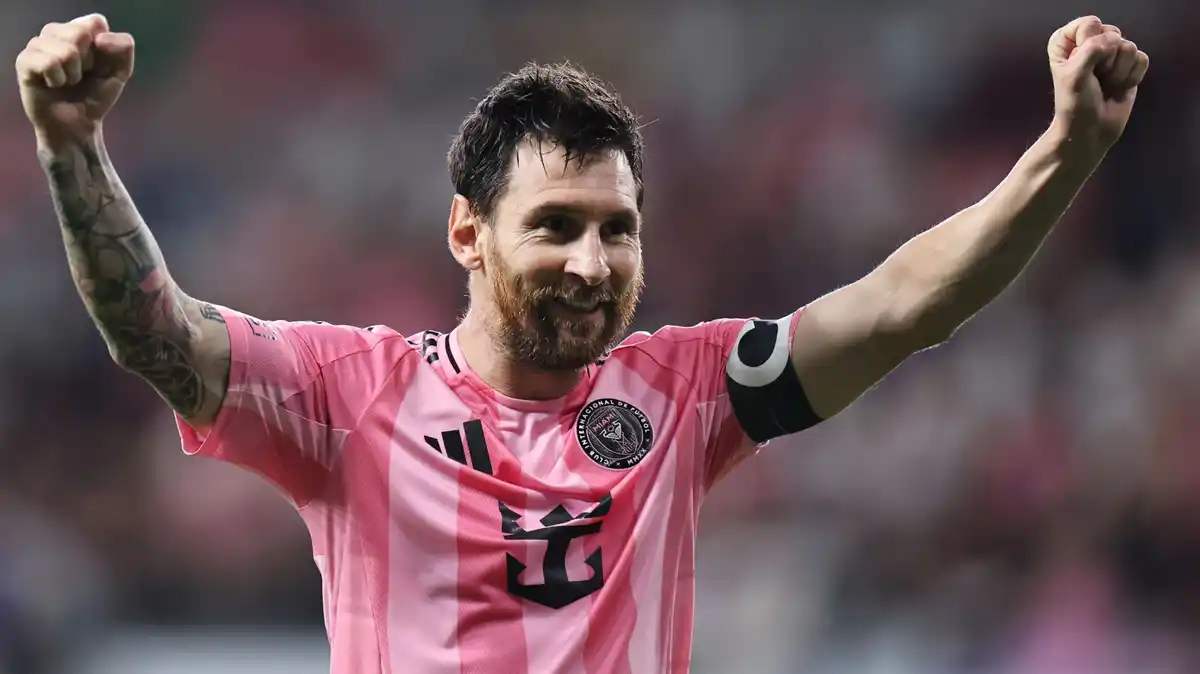 Lionel Messi holding his arms aloft in celebration while playing for Inter Miami