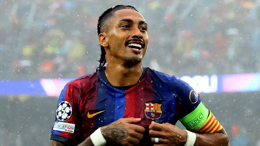 Raphinha celebrates scoring for Barcelona against Feyenoord in the Champions League