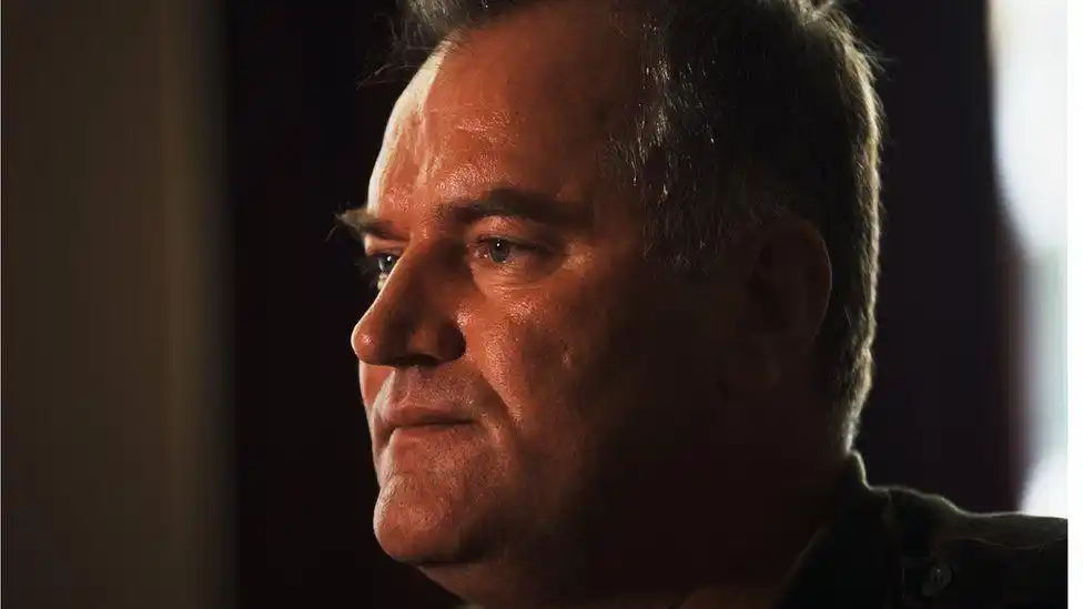 Ratko Mladić is photographed in a close up shot looking away from the camera