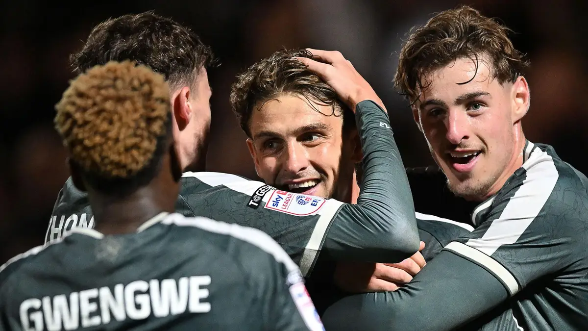Harrison Biggins celebrates with Newport team-mates