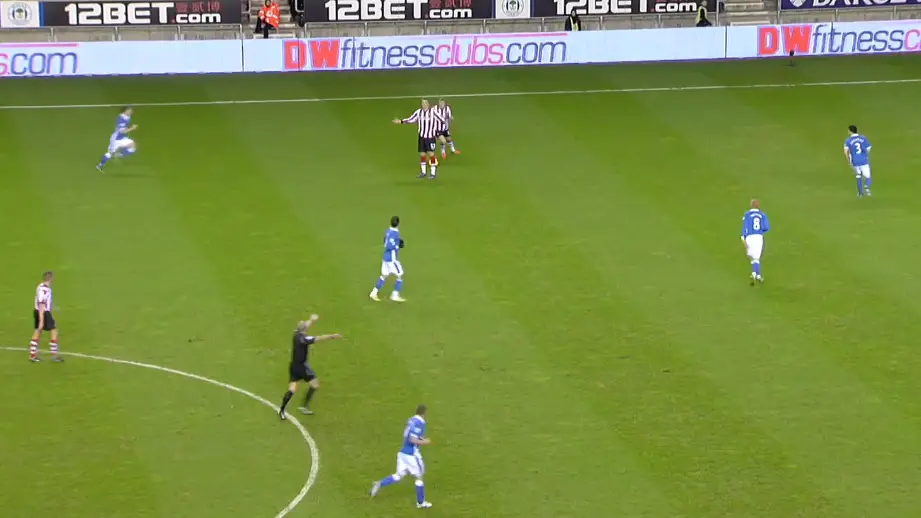 Referee Mike Dean plays advantage on a potential Sunderland free-kick